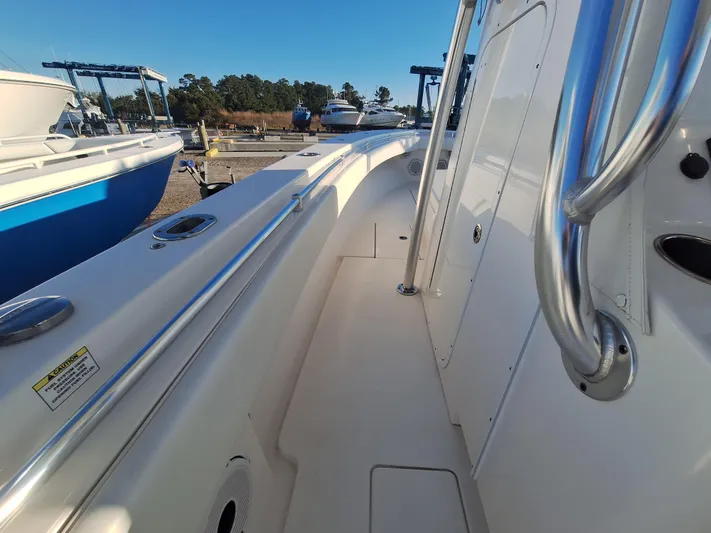 Salt Break Yacht Photos Pics 2020 Contender 32T boat deck with stainless steel railings in a marina setting.