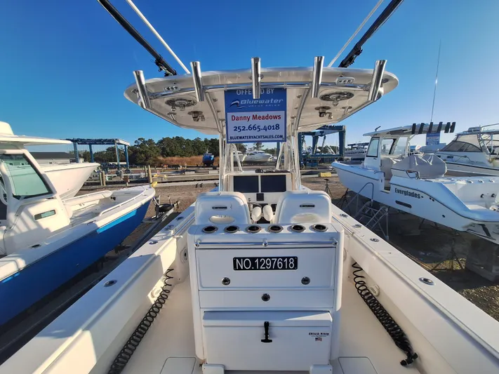 Salt Break Yacht Photos Pics 2020 Contender 32T boat at marina, featuring center console and rod holders.
