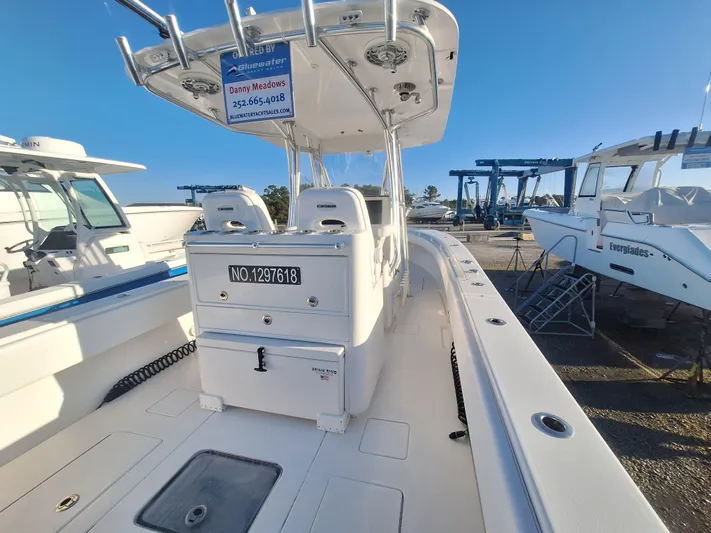 Salt Break Yacht Photos Pics 2020 Contender 32T boat in marina, featuring spacious deck and modern design.