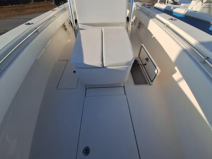 Salt Break Yacht Photos Pics 2020 Contender 32T boat interior with white seating and storage compartments.
