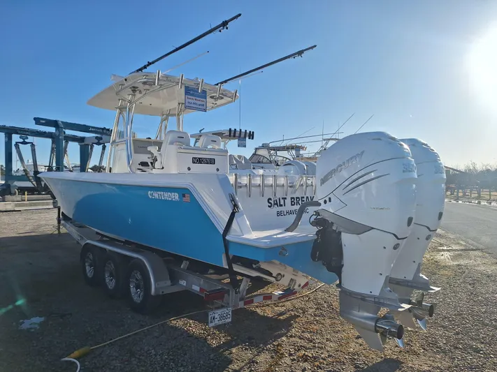 Salt Break Yacht Photos Pics 2020 Contender 32T boat with twin Mercury engines on a trailer in a marina.