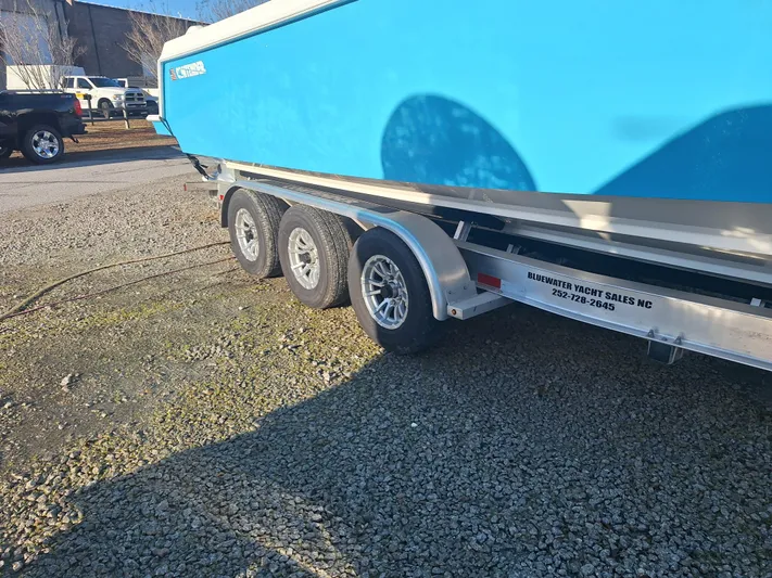 Salt Break Yacht Photos Pics 2020 Contender 32T boat on trailer, Bluewater Yacht Sales, gravel lot.