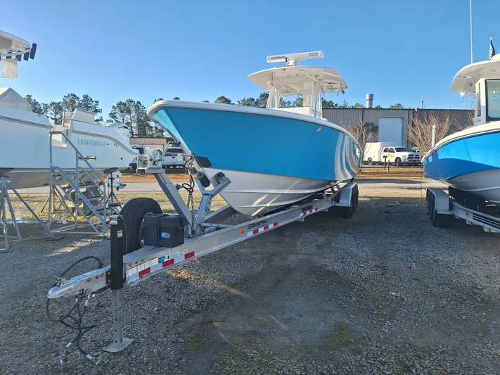 Salt Break Yacht Photos Pics 2020 Contender 32T boat on trailer, parked outdoors under clear blue sky.