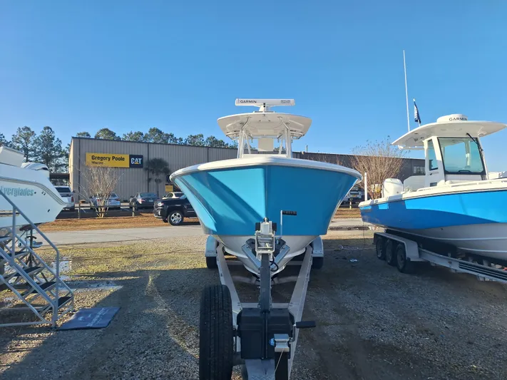 Salt Break Yacht Photos Pics 2020 Contender 32T boat on trailer at dealership, clear sky background.