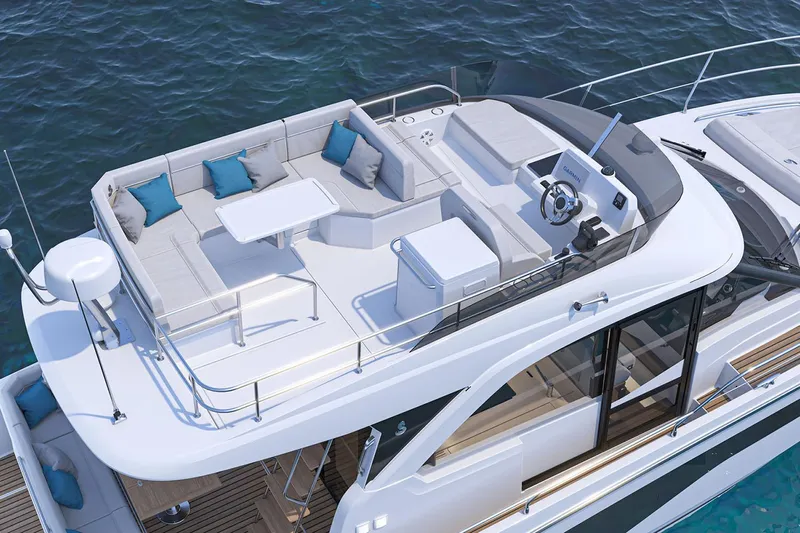 On Order Yacht Photos Pics Manufacturer Provided Image: 2025 Beneteau Antares 12 Flybridge with seating, table, and helm, on calm water.