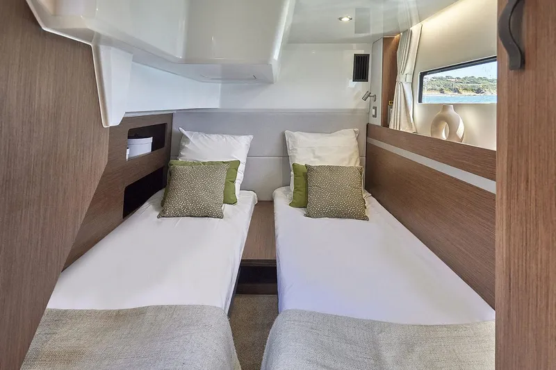 On Order Yacht Photos Pics Manufacturer Provided Image: Interior cabin of 2025 Beneteau Antares 12 Fly with twin beds and modern decor.