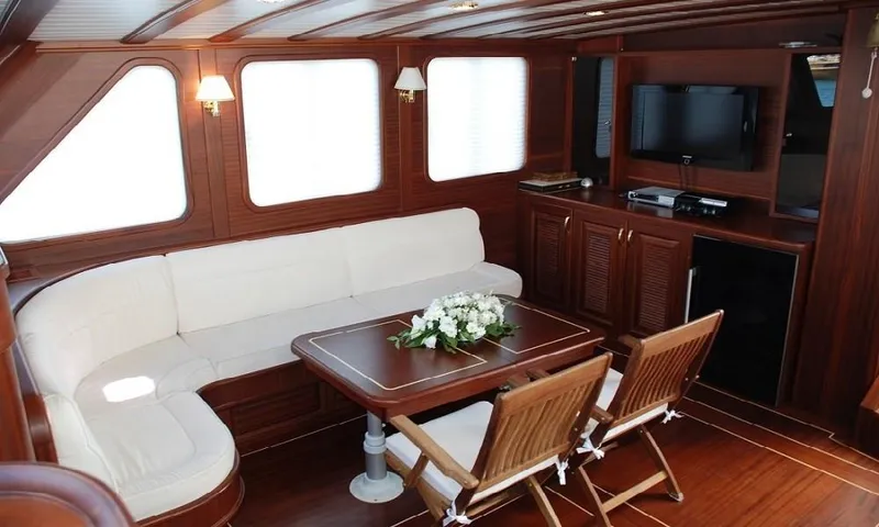  Yacht Photos Pics Luxurious 2009 custom motorsailor interior with elegant wood finish and comfortable seating.