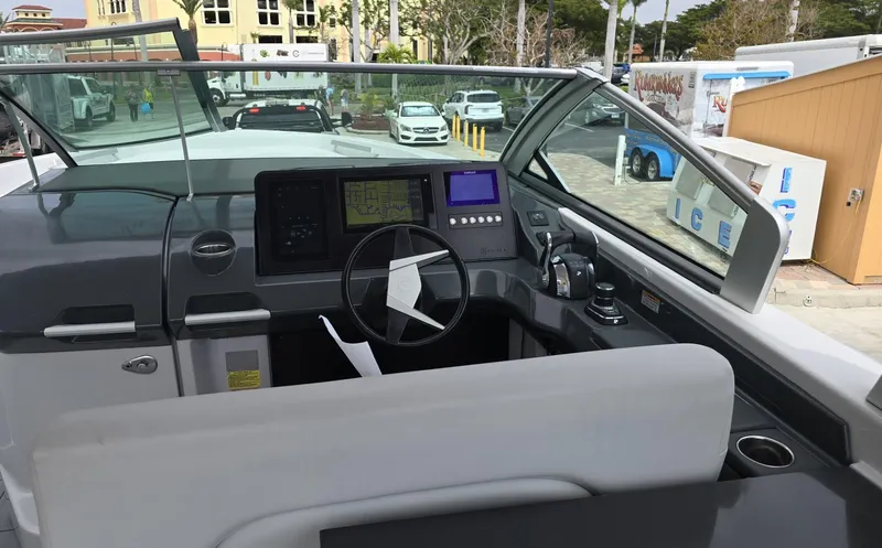  Yacht Photos Pics 2020 Aviara AV32 OB boat cockpit with modern controls and steering wheel.