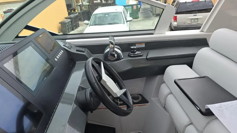  Yacht Photos Pics 2020 Aviara AV32 OB boat cockpit with modern steering and control panel.