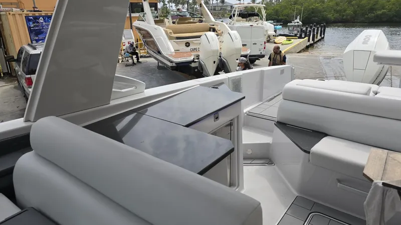  Yacht Photos Pics Aviara AV32 OB 2020 luxury boat interior with seating and dock view.