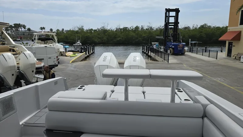  Yacht Photos Pics 2020 Aviara AV32 OB boat with dual outboard engines at a marina dock.