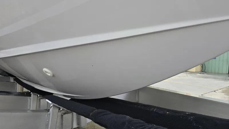  Yacht Photos Pics Close-up of 2020 Aviara AV32 OB boat hull on a trailer.