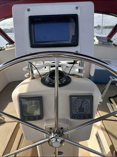 Next Course Yacht Photos Pics Steering wheel and navigation instruments on a 2001 Island Packet 320 sailboat.
