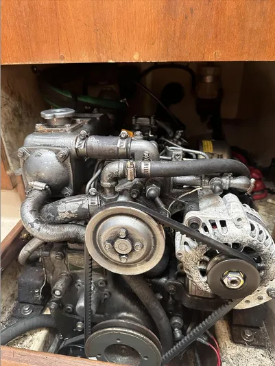 Next Course Yacht Photos Pics Engine compartment of a 2001 Island Packet 320 sailboat, showcasing mechanical components.