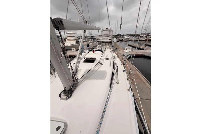 Mary Anne Yacht Photos Pics 2009 Hunter 38 sailboat docked at marina under cloudy skies.