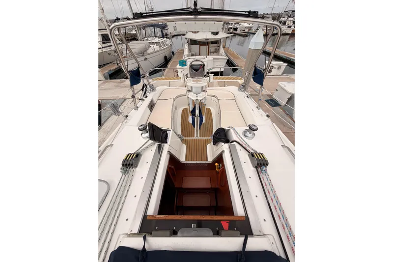Mary Anne Yacht Photos Pics 2009 Hunter 38 sailboat cockpit with open cabin, docked at marina.