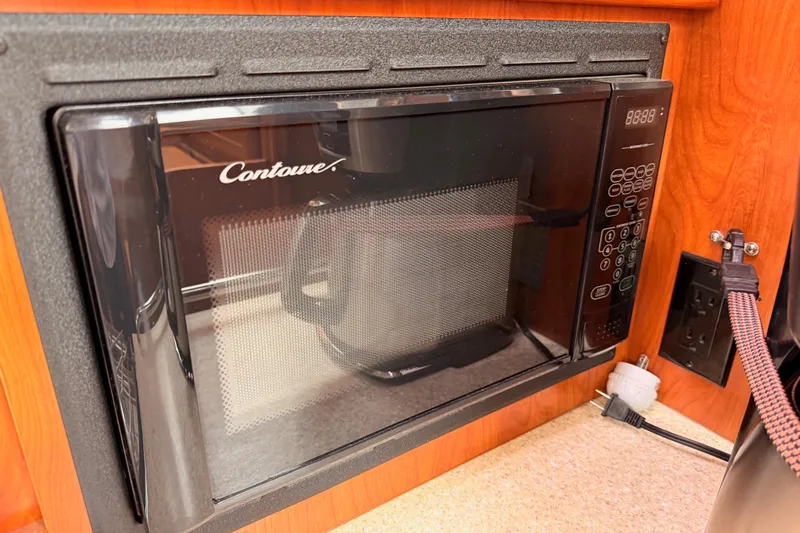 Mary Anne Yacht Photos Pics Built-in Contoure microwave in a 2009 Hunter 38 yacht kitchen.