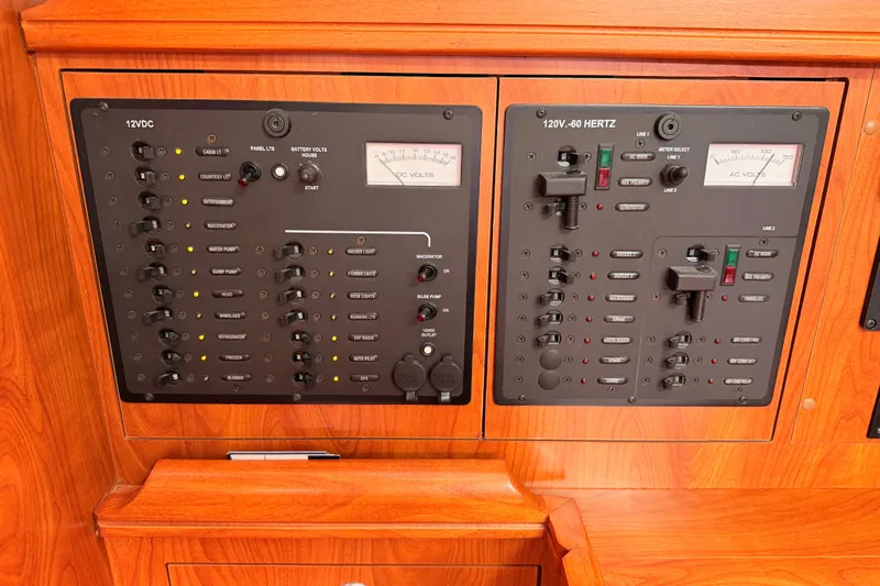 Mary Anne Yacht Photos Pics Electrical control panel on a 2009 Hunter 38 yacht, featuring 12VDC and 120V-60 Hertz systems.