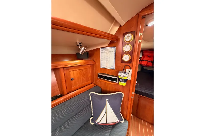 Mary Anne Yacht Photos Pics Interior of 2009 Hunter 38 sailboat with nautical decor and wooden cabinetry.