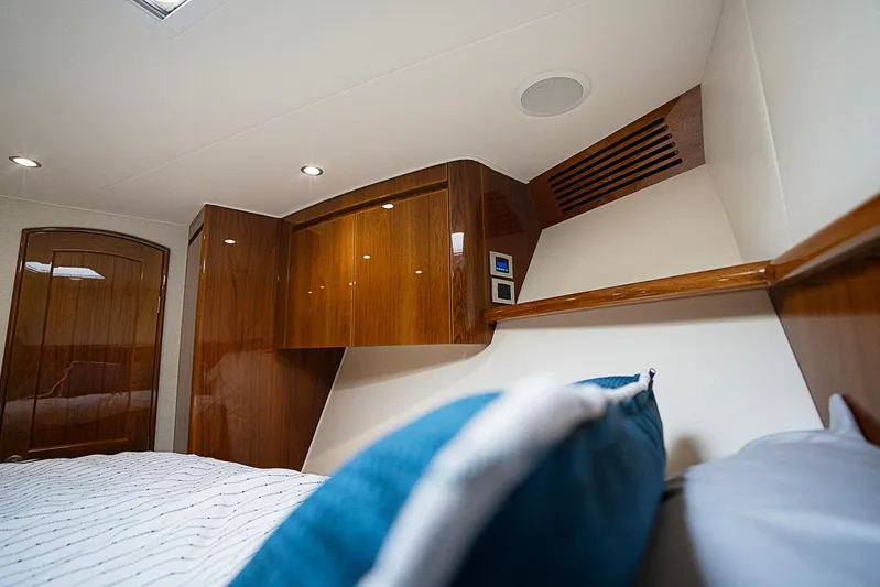 Serenity Now Yacht Photos Pics Luxurious interior of 2014 Viking 66 yacht with polished wood and modern lighting.