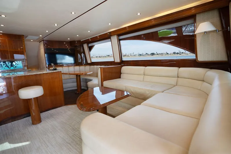 Serenity Now Yacht Photos Pics Luxurious interior of a 2014 Viking 66 yacht with elegant seating and wood finishes.