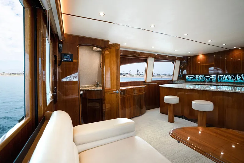 Serenity Now Yacht Photos Pics Luxurious interior of 2014 Viking 66 yacht with elegant wood finishes and ocean view.