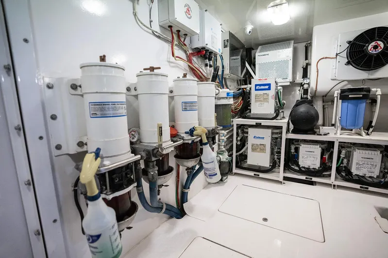 Serenity Now Yacht Photos Pics Engine room of a 2014 Viking 66 yacht, featuring filters and equipment.