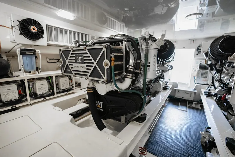Serenity Now Yacht Photos Pics Engine room of a 2014 Viking 66 yacht featuring CAT marine power engine.