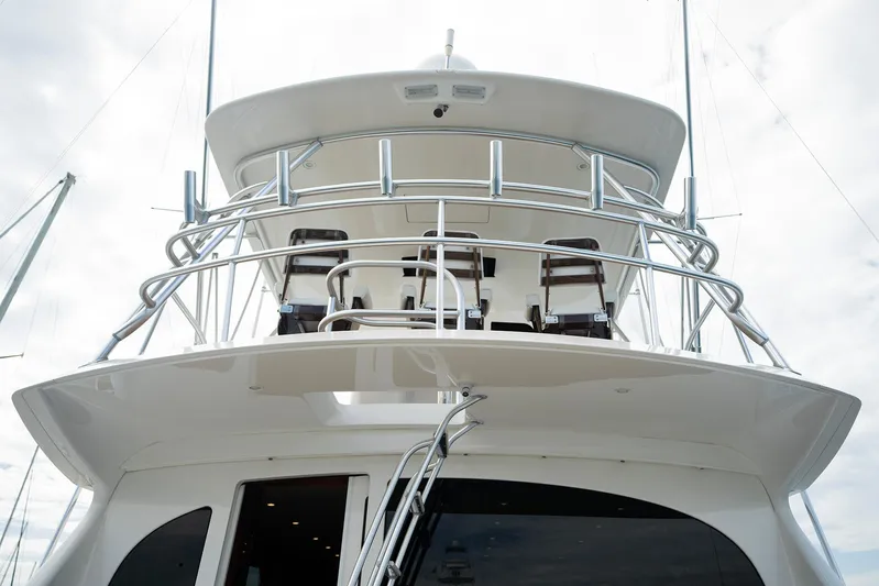Serenity Now Yacht Photos Pics 2014 Viking 66 yacht with sleek design and upper deck view.