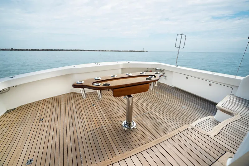 Serenity Now Yacht Photos Pics Luxurious 2014 Viking 66 yacht deck with wooden flooring and ocean view.
