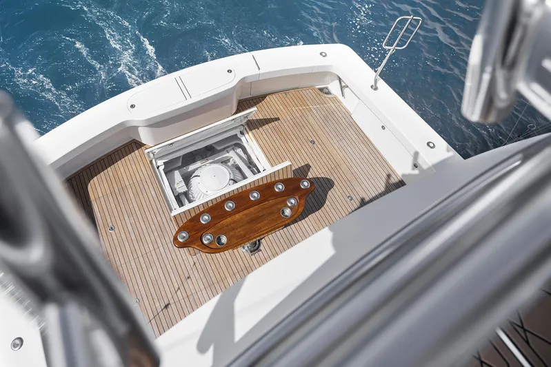 Serenity Now Yacht Photos Pics 2014 Viking 66 yacht deck with wooden flooring and ocean view.