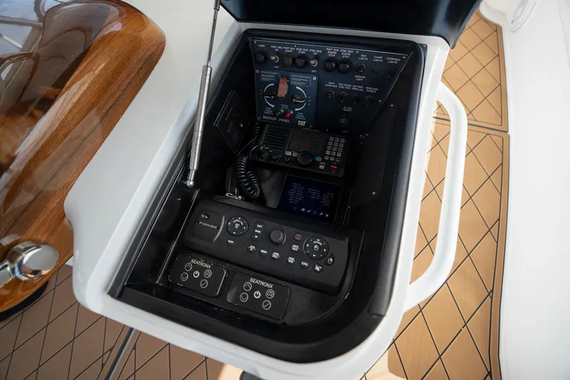 Serenity Now Yacht Photos Pics Control panel of a 2014 Viking 66 yacht with navigation and communication equipment.