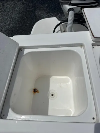  Yacht Photos Pics Open storage compartment on 2015 Ocean Master 296 boat, showing interior detail.