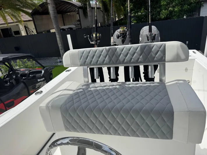  Yacht Photos Pics Luxury seating on a 2015 Ocean Master 296 boat with fishing rods in holders.