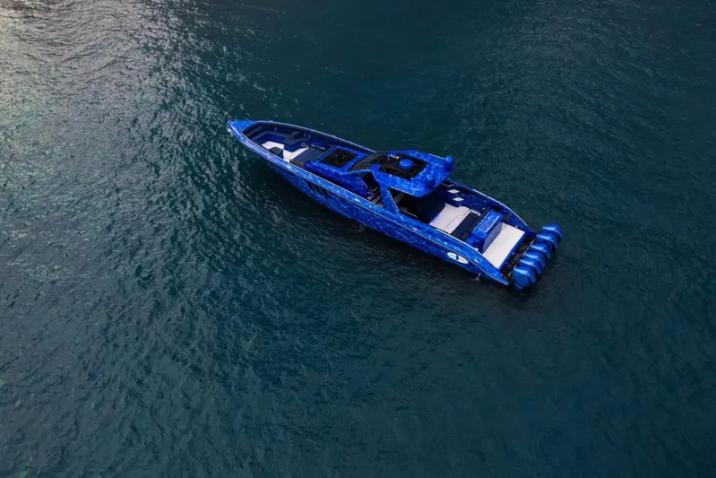  Yacht Photos Pics Aerial view of 2024 Cigarette 59 Tirranna boat in blue on open water.