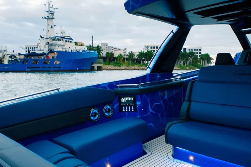  Yacht Photos Pics Luxurious interior of 2024 Cigarette 59 Tirranna yacht with modern seating and ambient lighting.