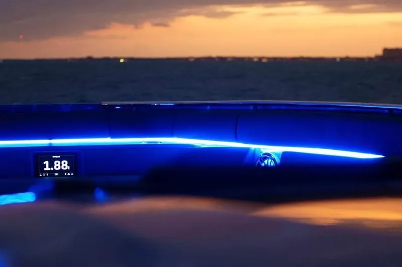  Yacht Photos Pics 2024 Cigarette 59 Tirranna boat interior with blue LED lighting at sunset.