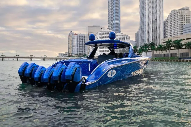  Yacht Photos Pics 2024 Cigarette 59 Tirranna boat with multiple engines on urban waterfront.