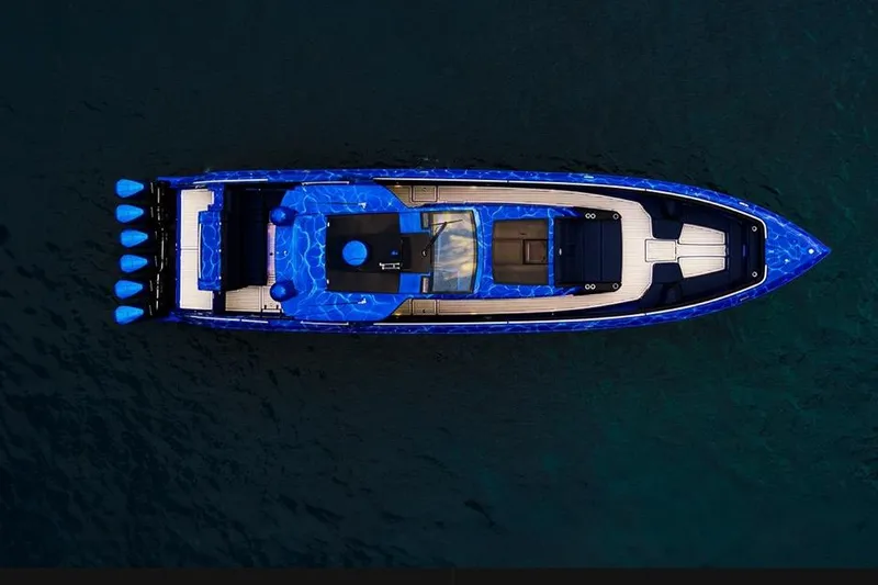  Yacht Photos Pics Aerial view of 2024 Cigarette 59 Tirranna boat with vibrant blue design on water.
