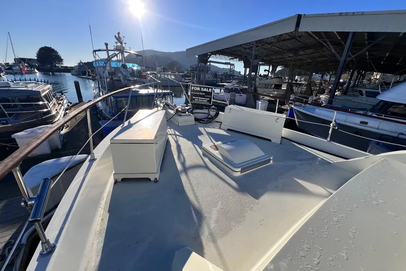 Grand Adventure Yacht Photos Pics 1972 Hatteras 58 Yacht Fisherman docked, sunlit deck, marina view, "For Sale" sign visible.