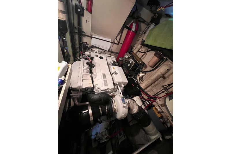 Grand Adventure Yacht Photos Pics Engine room of a 1972 Hatteras 58 Yacht Fisherman, showcasing mechanical components.