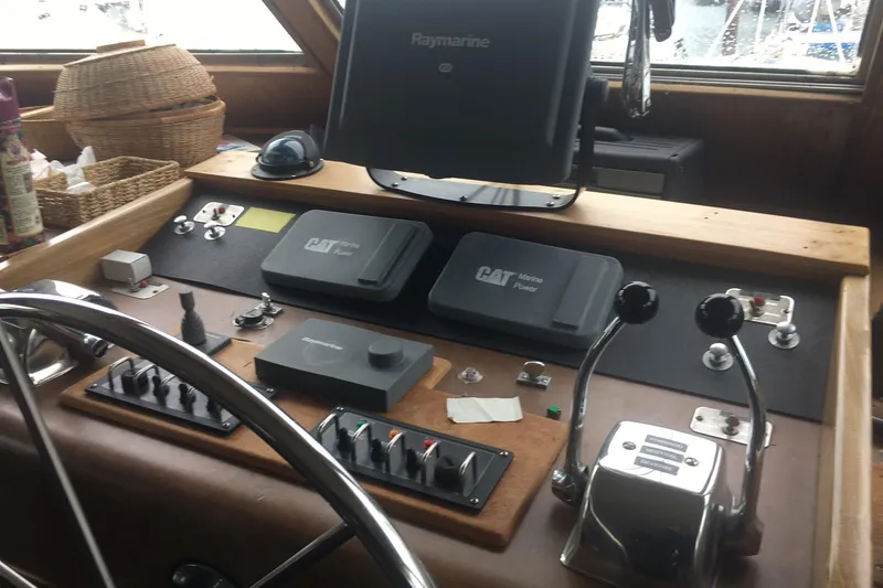Grand Adventure Yacht Photos Pics Helm of 1972 Hatteras 58 Yachtfish with navigation and control equipment.