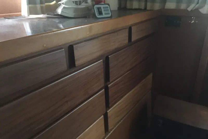 Grand Adventure Yacht Photos Pics Interior of 1972 Hatteras 58 Yachtfish showing wooden cabinetry and countertop.