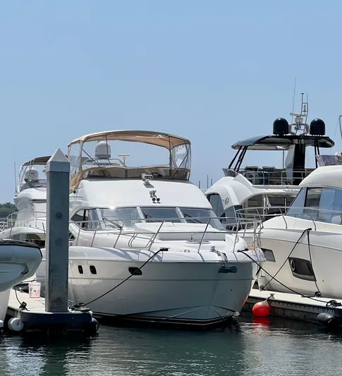 Sea Banshee Yacht Photos Pics Luxury 2000 Viking Princess 52 Flybridge yacht docked at marina.