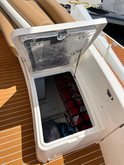 Sea Banshee Yacht Photos Pics Open storage compartment on 2000 Viking Princess 52 Flybridge yacht, revealing life jackets and gear.