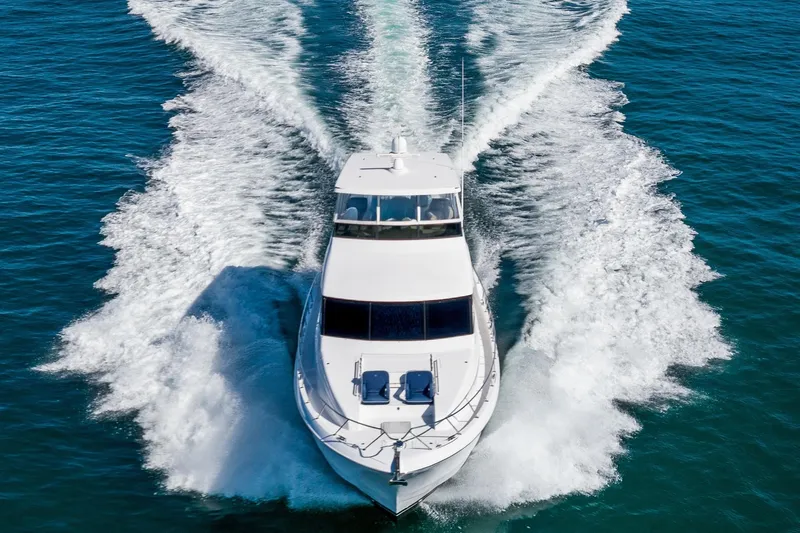 Elsewhere Yacht Photos Pics 2013 Hatteras 60 Motor Yacht cruising on open water, aerial view.