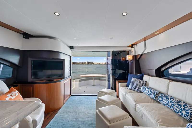 Elsewhere Yacht Photos Pics Luxurious interior of 2013 Hatteras 60 Motor Yacht with elegant seating and waterfront view.