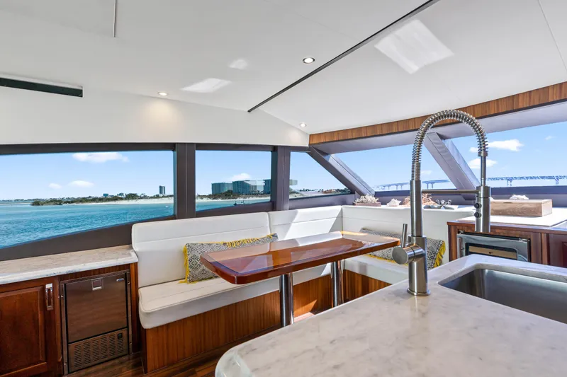 Elsewhere Yacht Photos Pics Luxurious interior of 2013 Hatteras 60 Motor Yacht with ocean view and modern amenities.