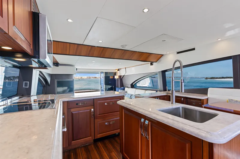 Elsewhere Yacht Photos Pics Luxurious kitchen interior of 2013 Hatteras 60 Motor Yacht with ocean view.