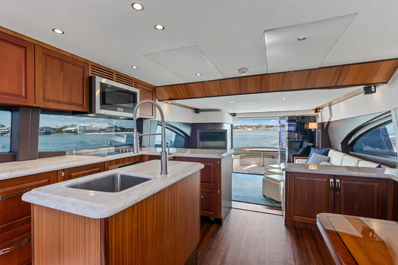 Elsewhere Yacht Photos Pics Luxurious interior of 2013 Hatteras 60 Motor Yacht with modern kitchen and scenic views.